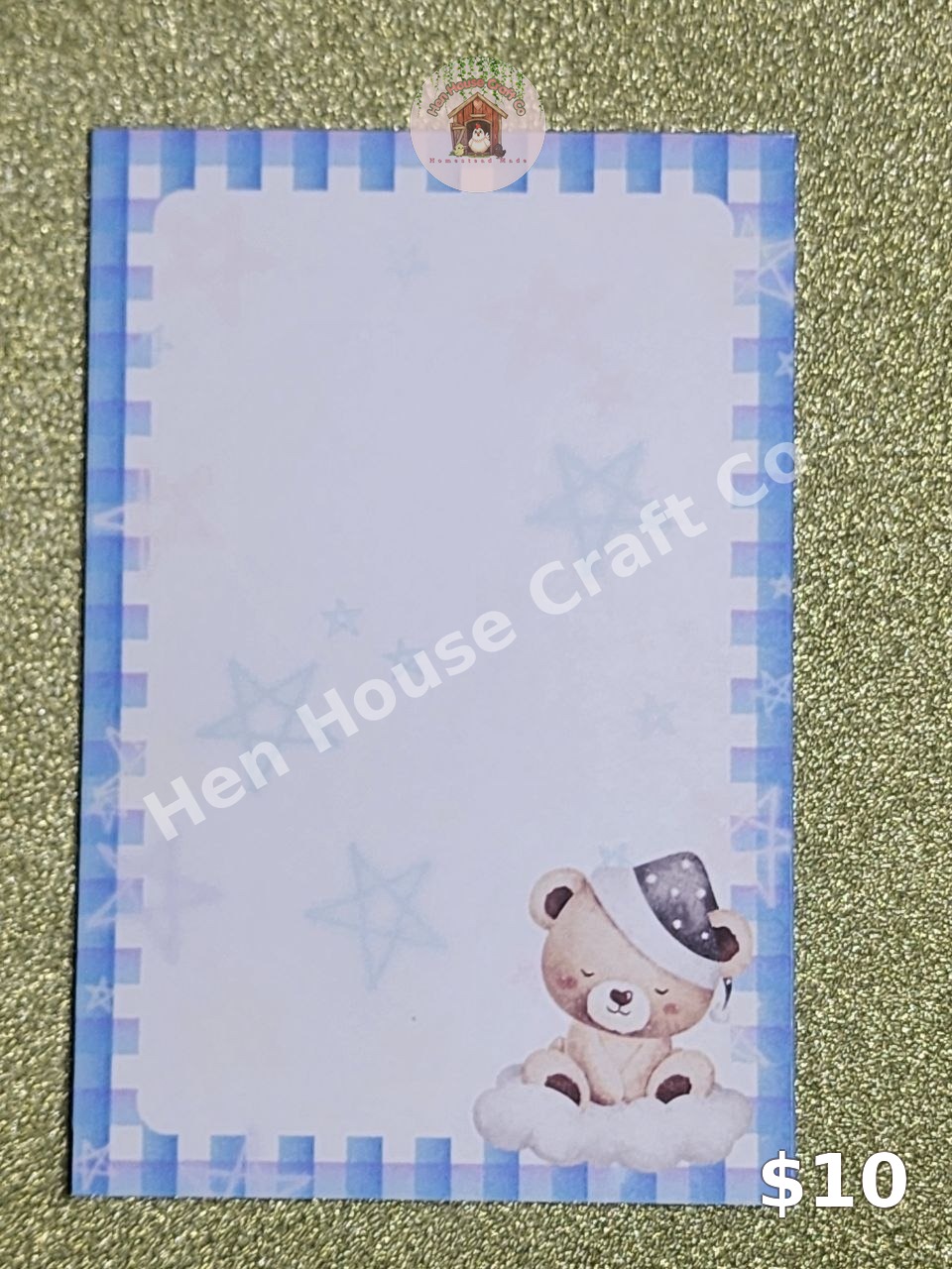 Blue Plaid Dreamy Bear notepad — a sleeping teddy bear in a starry nightcap on a cloud, with a blue plaid border and pale stars